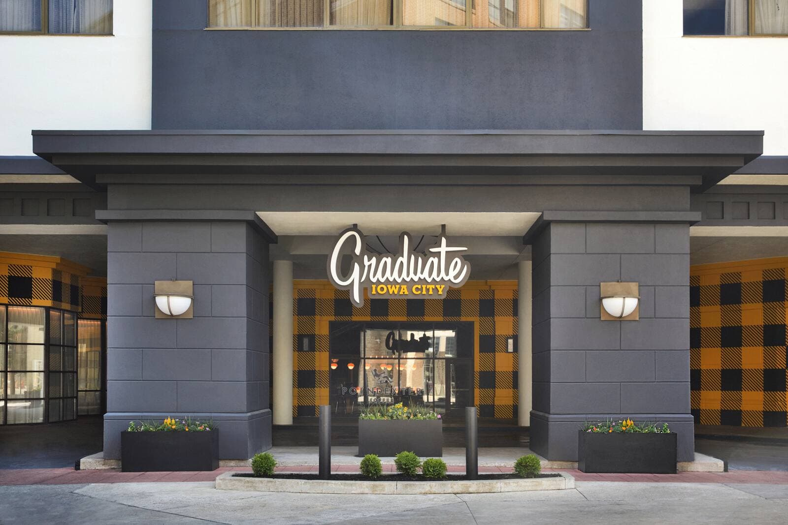 Graduate by Hilton Iowa City, with its black-and-gold check entrance on the downtown Pedestrian Mall