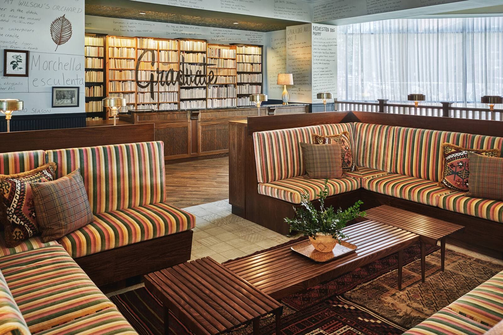 Lounge seating tucked among the lobby's floor-to-ceiling bookshelves