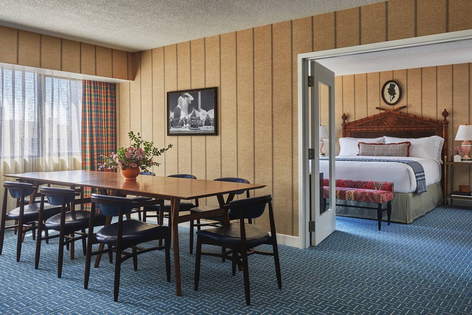 A guest suite with a king bed and a dining table